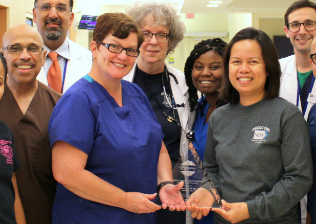 Clinical Center Intensive Care Unit staff proudly display the award.