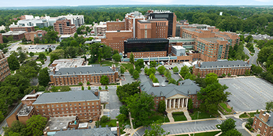 Photo of buildings on the NIH campus, including the East side of the NIH Clinical Center