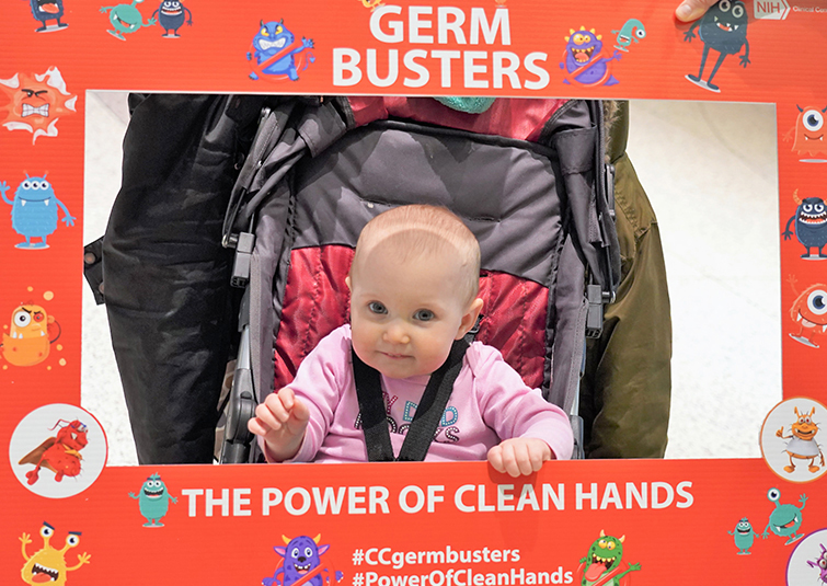 infant poses for photo