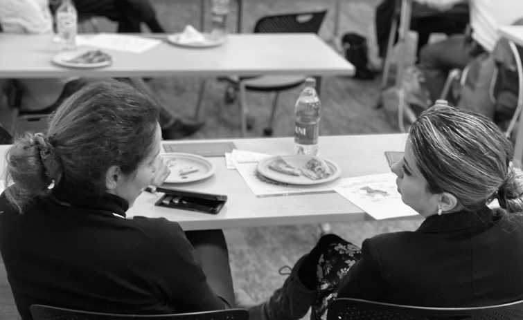 two women talk to each other