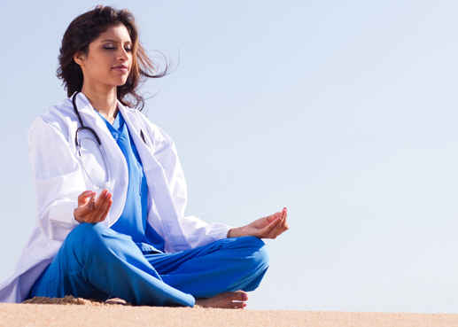 doctor meditating on beach