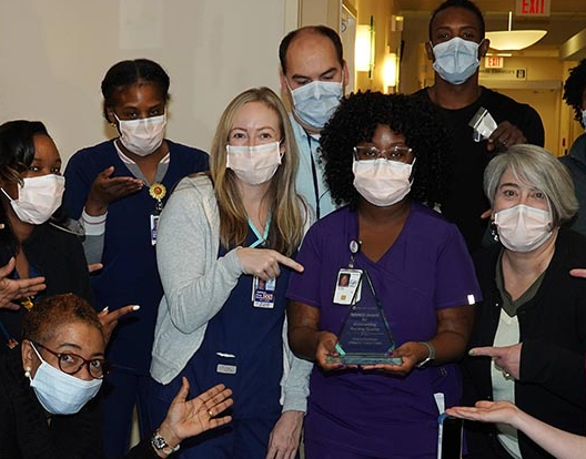 nursing staff with award