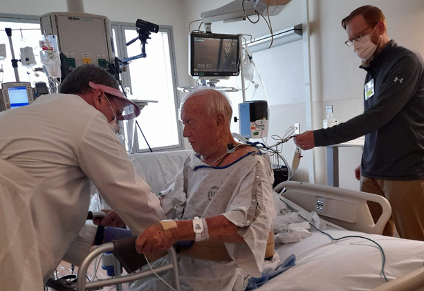 patient being cared for by Clinical Center staff