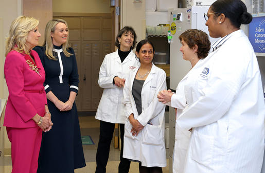 six individuals talking n an NCI lab