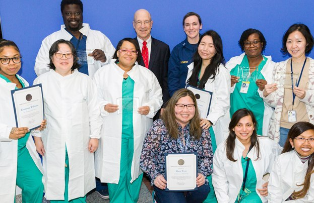 Pharmacy staff proudly displaying their awards