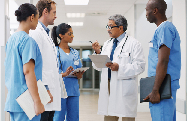 medical personnel talking in a hallway