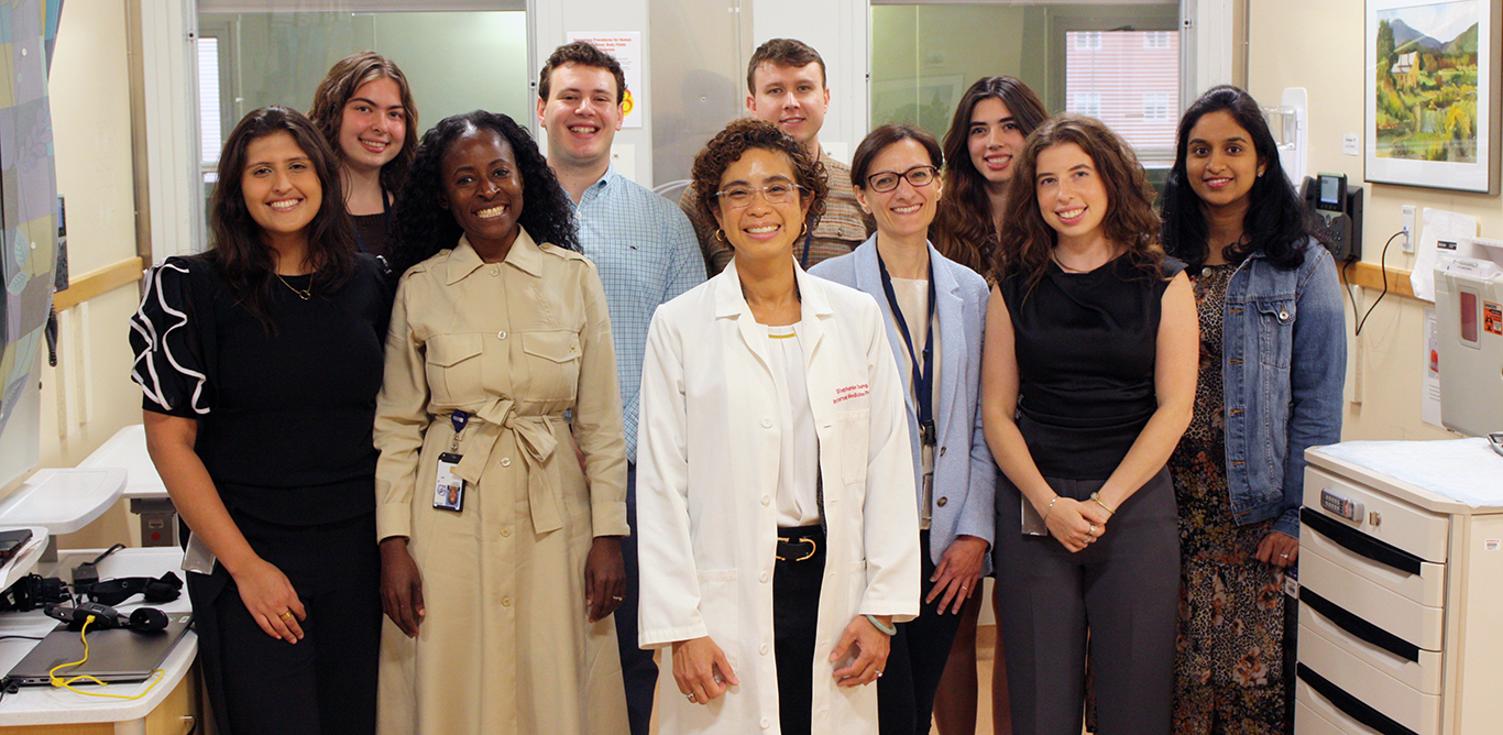group of people with Dr. Stephanie Chung in the center.