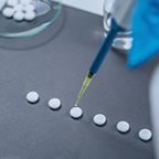 pills being examined by a medical professional