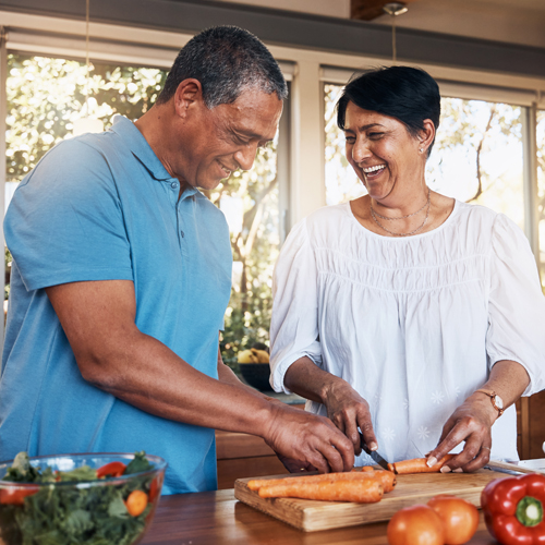 two people cooking