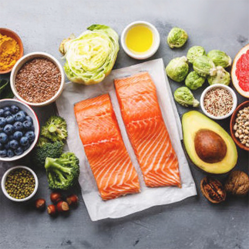 fresh salmon and vegetables on table