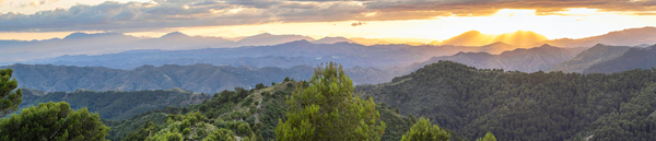 sun rising over mountains