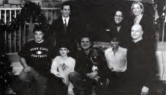 eight individuals posing together