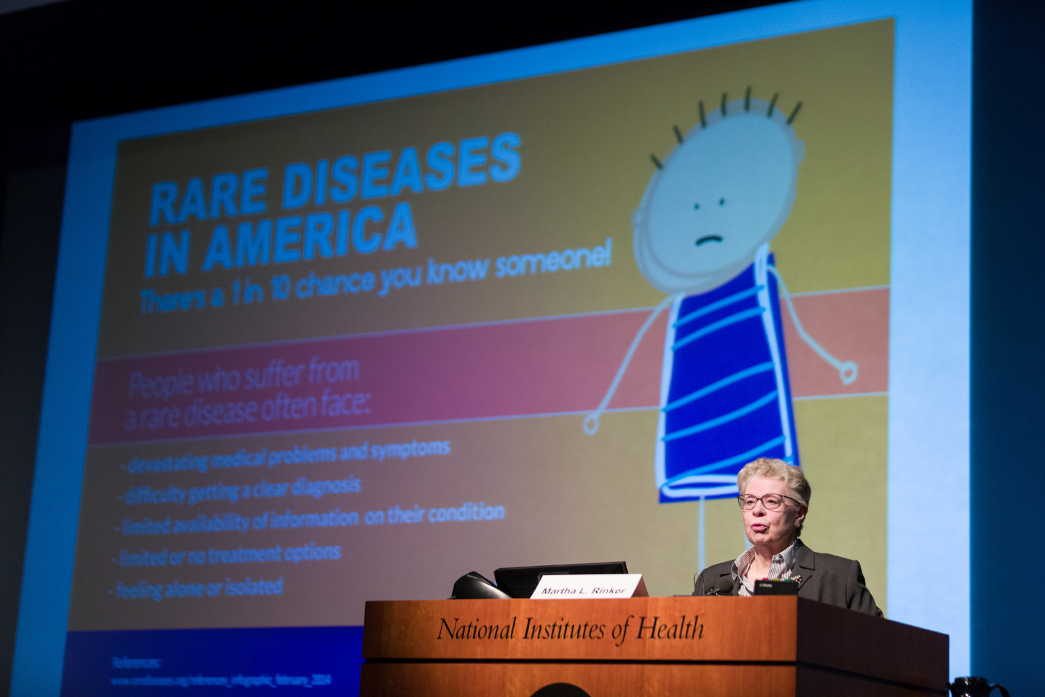 Martha Rinker, speaker from the non-profit National Organization for Rare Disorders (NORD), addresses the audience on Rare Disease Day Feb. 29, 2016, at the NIH Clinical Center.