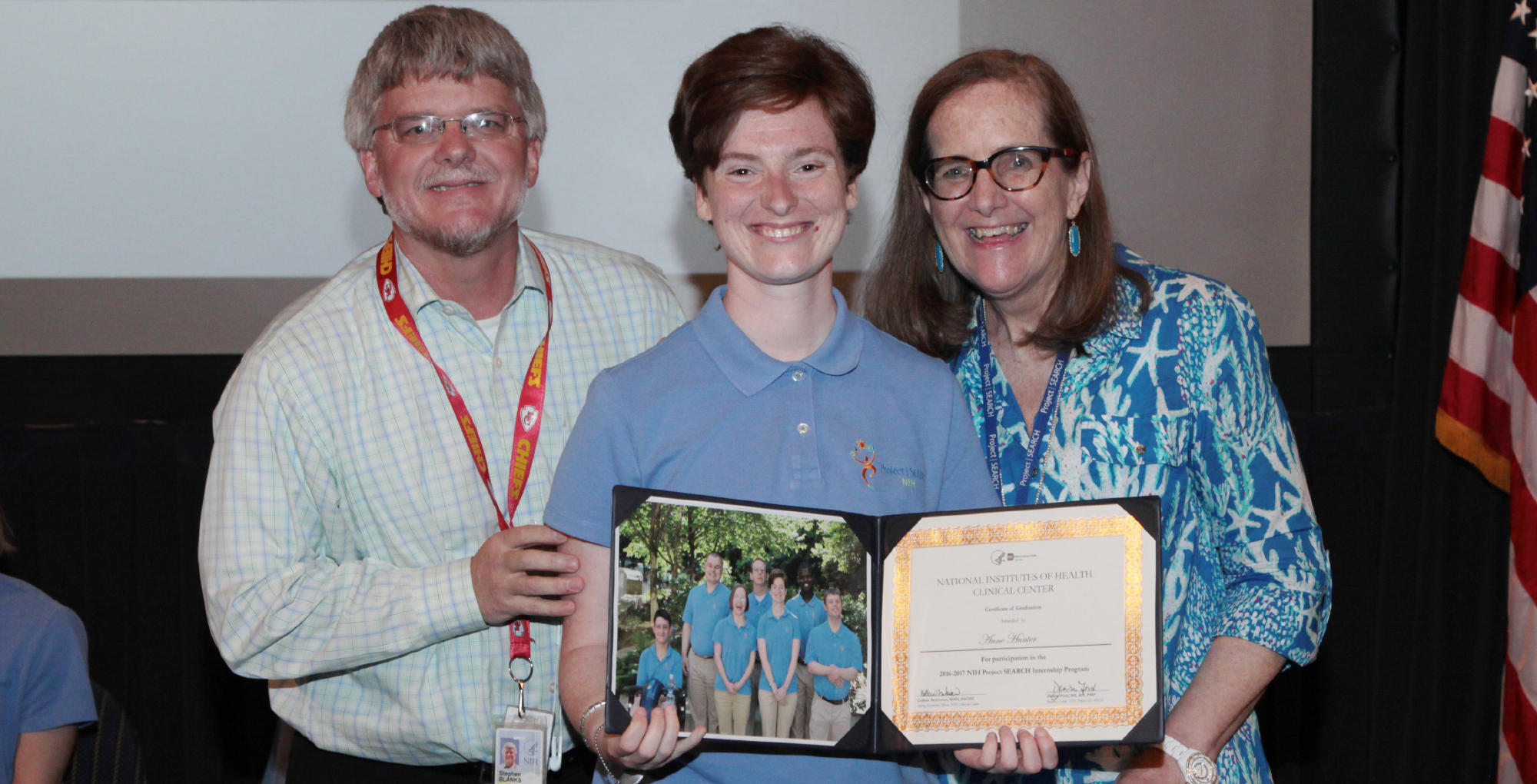 Graduate Annabel Hunter (center) is joined by supporters of the program at NIH: Steve Blanks with SEEC and Lu Merrick with the Ivymount School