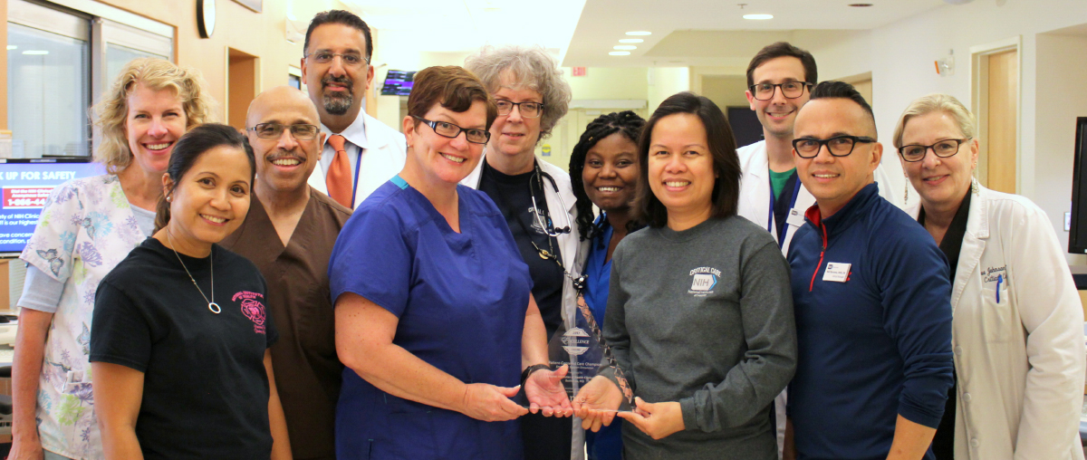 Clinical Center Intensive Care Unit staff proudly display the award. The trophy circulated throughout the hospital for staff to enjoy the honor and be photographed.