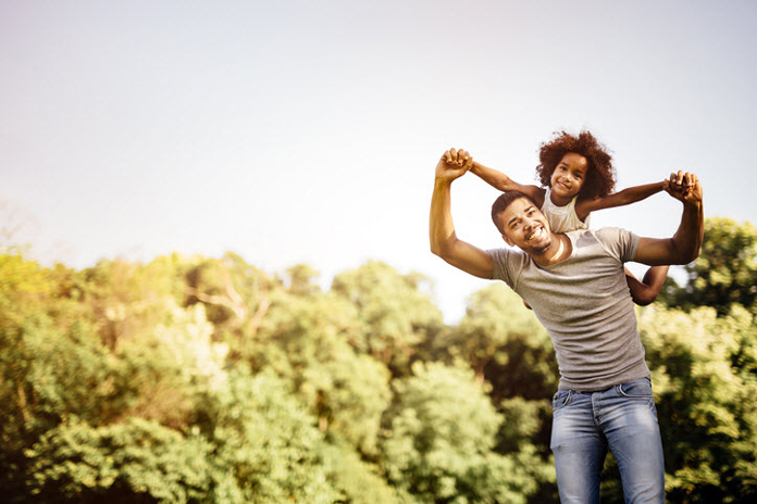 Man with daughter on his shoulders