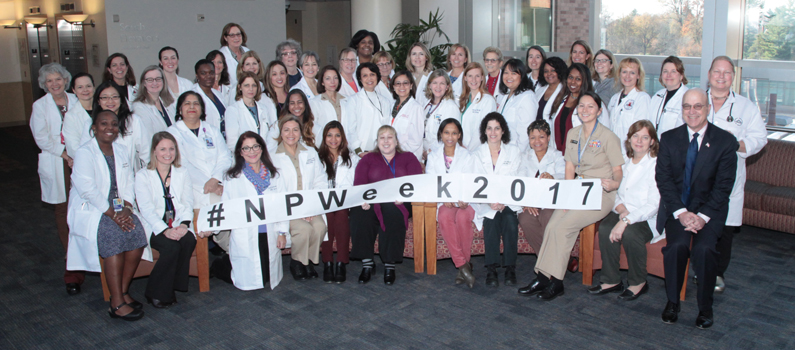 Roughly 50 nurse practitioners gather in the Clinical Center for a photo