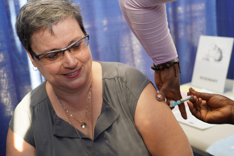 Mary Sparks receiving a flu shot