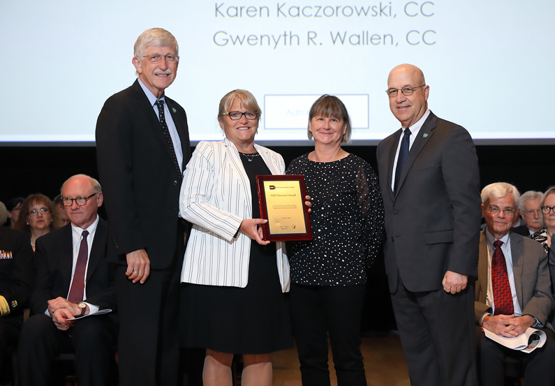 Dr. Francis Collins, Code Yellow Leadership Team members Gwenyth Wallen and Karen Kaczorowski, and Dr. Jim Gilman