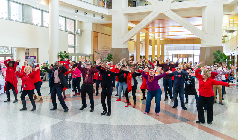 People dance in the atrium