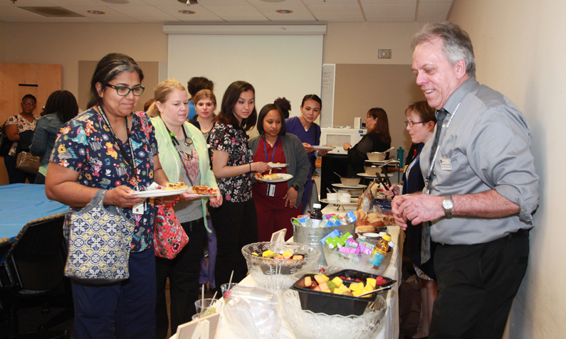 Nursing leadership staff serves breakfast for night shift nurses