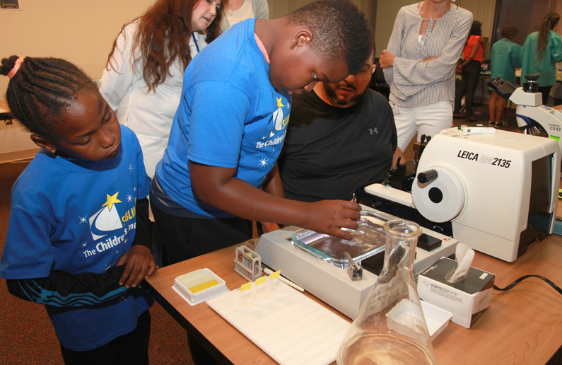 A patients brother and sister conduct a science experiment