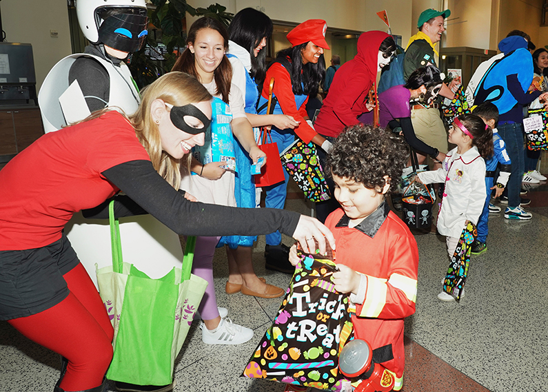 Pediatric patients are given candy by departments at the Clinical Center
