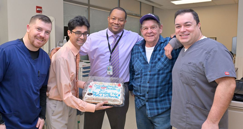 Group of people celebrating Bill Cervenka's 400th platelets donation