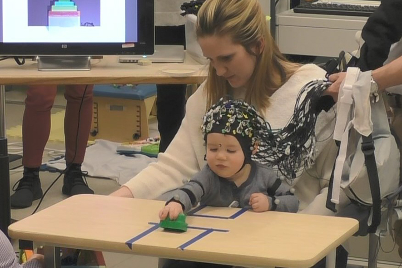 mother and child playing with a toy