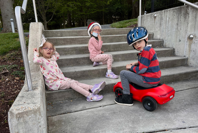 Three children playing outside