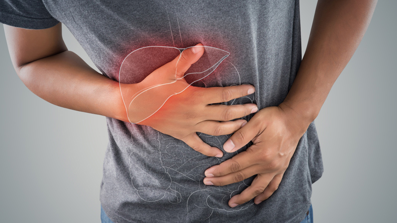 Photo of man grabbing his abdomen with an outline of the liver