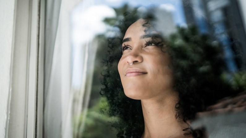 Woman looking out a window