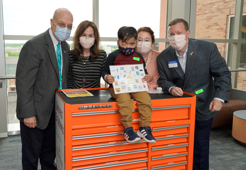 Staff and patient at the unveiling of the Wellness on Wheels cart