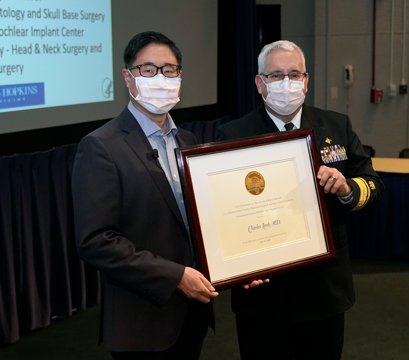 Presenter receives certificate of appreciation after his lecture