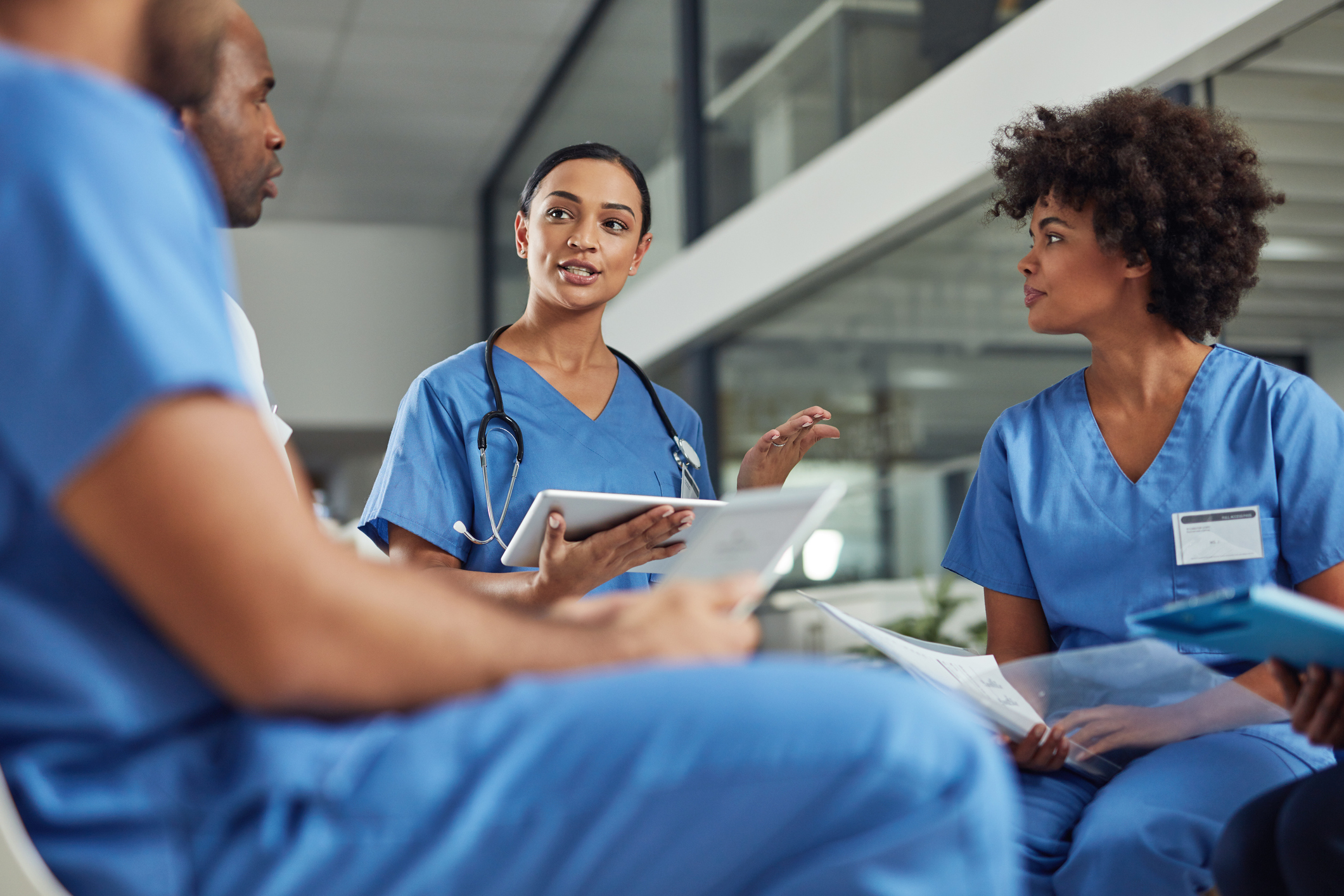 NIH staff discussing with one another.