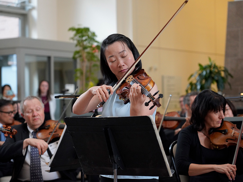 Jing Qiao performing in the CC North Atrium