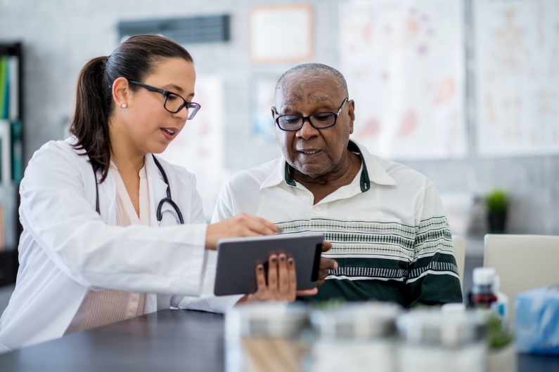 man consulting with doctor