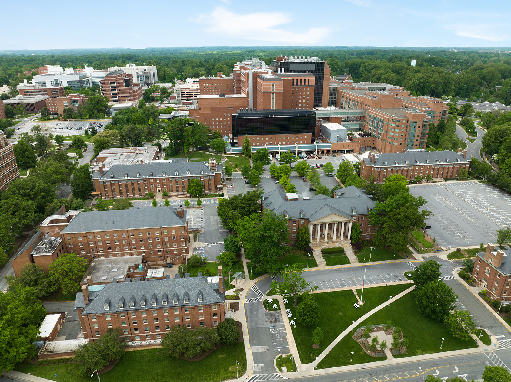 Photo of buildings on the NIH campus, including the East side of the NIH Clinical Center