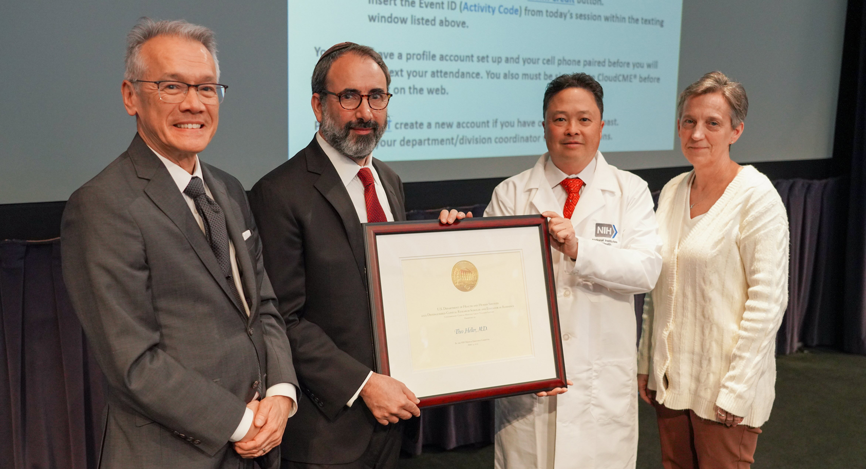 Doctors present framed certificate to honored speaker