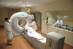 Doctors and a nurse working with a patient.