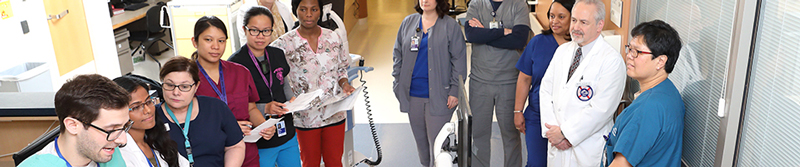 The clinical fellow on-call leads morning rounds on the ICU, providing patient information about underlying diseases and prior history to the multidisciplinary health care team