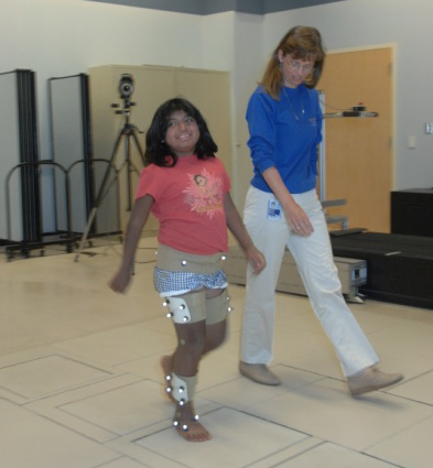 patient walking with therapist