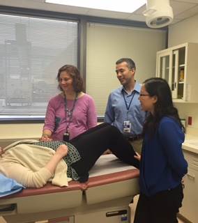 Pain and Palliative Care Service (PPCS) staff speaking with a patient