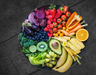 A dish containing a variety of healthy fruit and vegetables