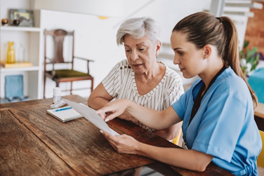 A healthcare professional speaking with a patient