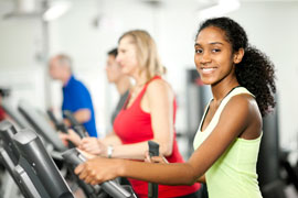 people working out on exercise equipment