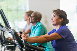 people working out on exercise equipment