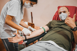 doctor drawing a patient's blood