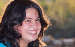 Girl smiling for the camera.