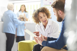 a doctor speaking to a patient